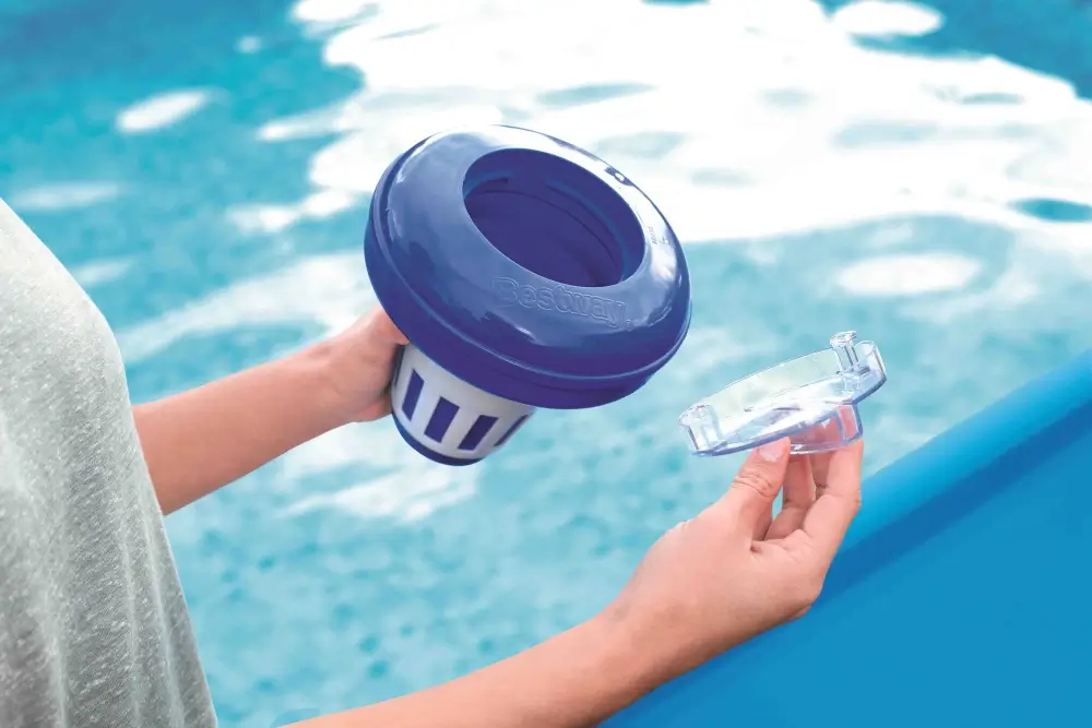 Pool chemical dispenser floating in water