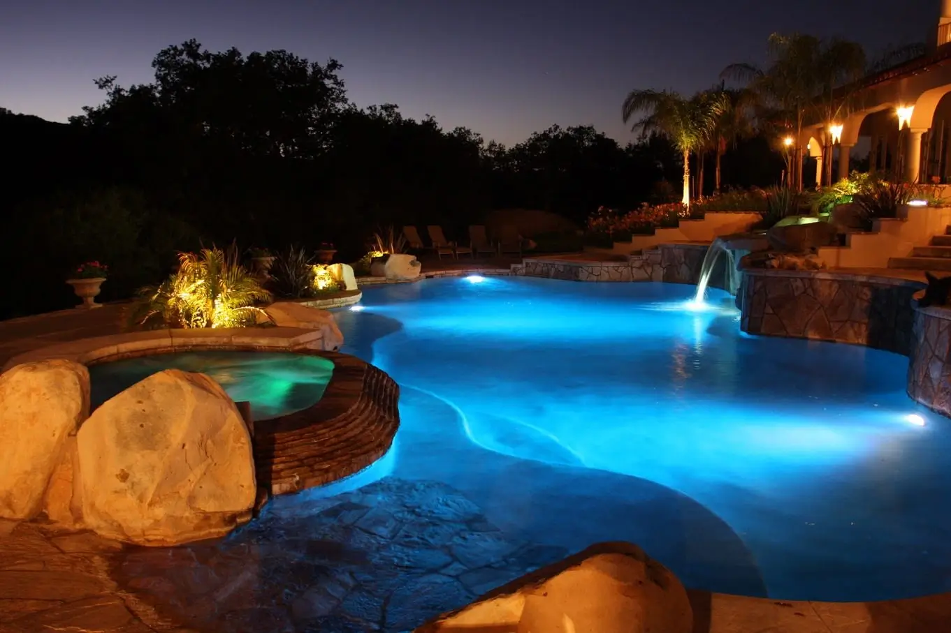 The same pool beautifully illuminated at night