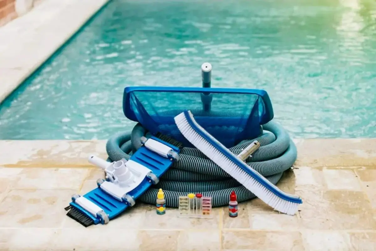 A person cleaning a pool filter cartridge